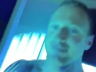 Big dick tattoo boy jerks off in a tanning bed